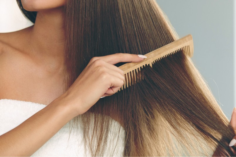 Brushing-Hair.-Portrait-Of-Sexy-Young-Woman-Brushing-Straight-Natural-Hair-With-Comb.-805x537